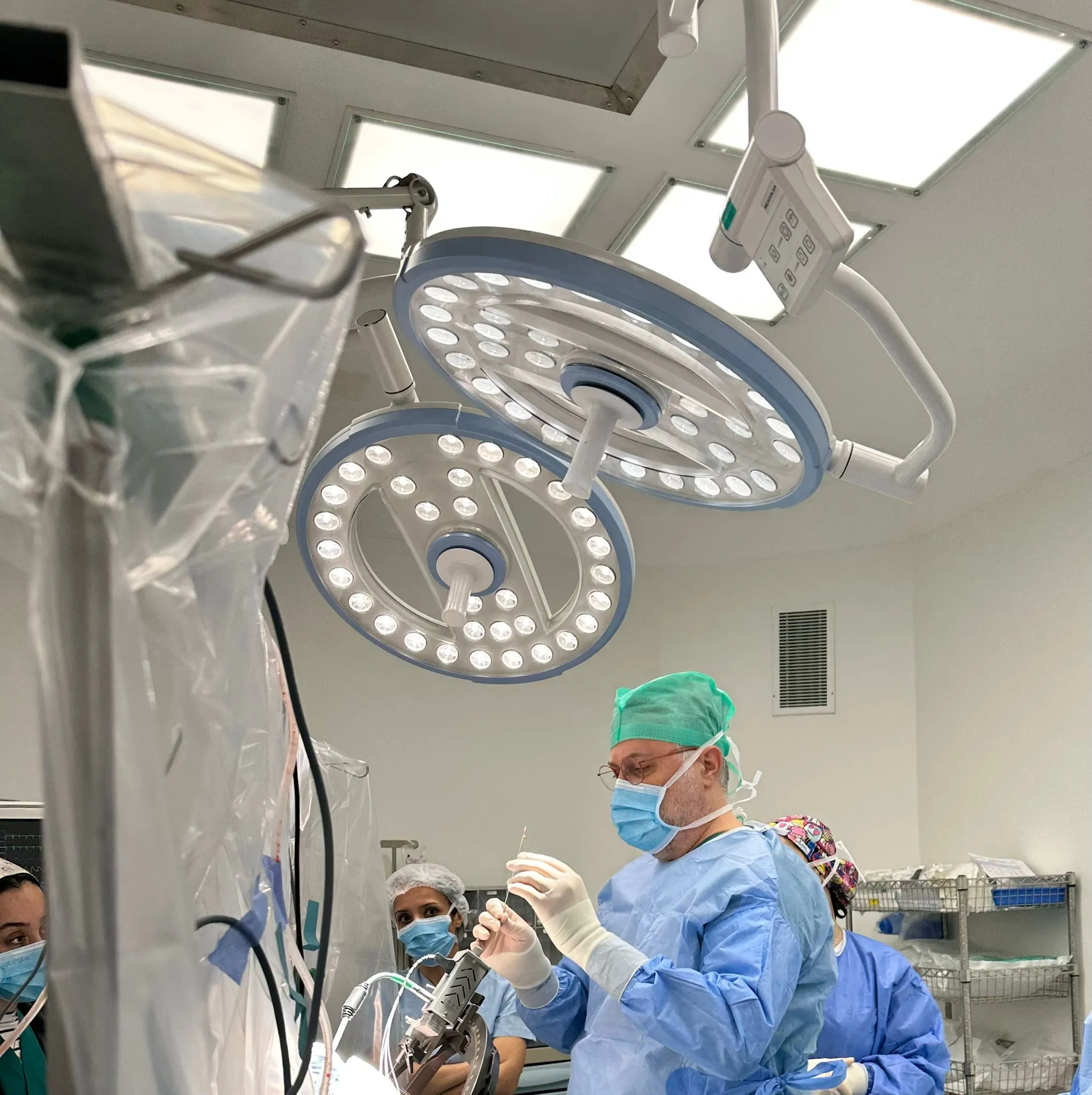 Prof. Dr. Kocabicak performing DBS surgery in the operating theatre