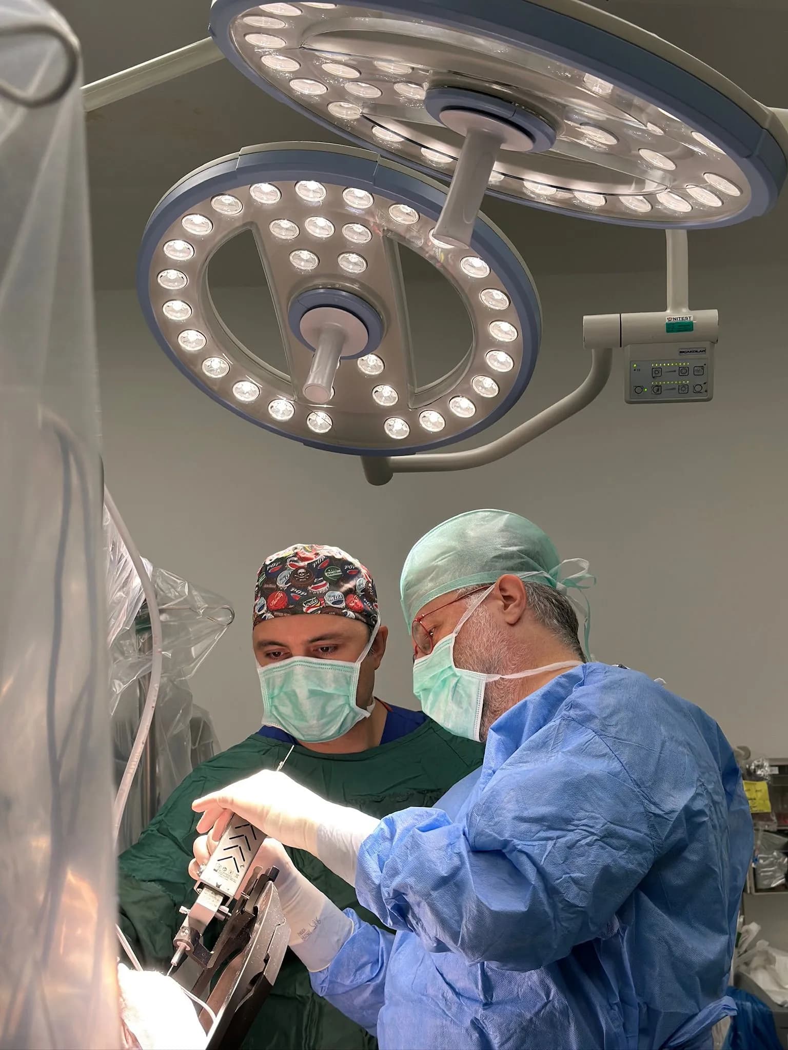 Surgeon and assistant operating with stereotactic equipment